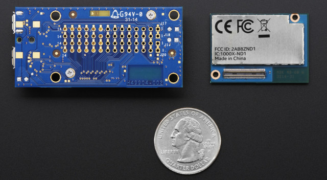 The Intel Edison (right) and breakout board (left) compared to a quarter. 